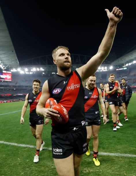 Jake Stringer of the Bombers celebrates after his 150th match during the 2021 AFL Round 17 match between the Essendon Bombers and the Adelaide Crows...
