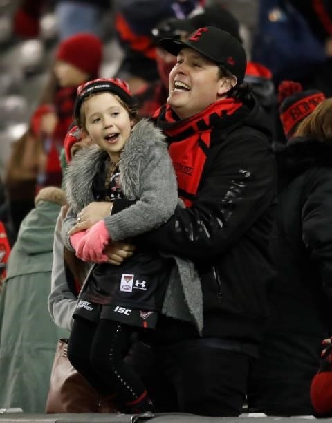 Bombers fans celebrate during the 2021 AFL Round 17 match between the Essendon Bombers and the Adelaide Crows at Marvel Stadium on July 9, 2021 in...