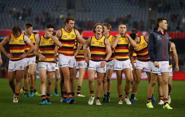 The Crows look dejected after a loss during the 2021 AFL Round 17 match between the Essendon Bombers and the Adelaide Crows at Marvel Stadium on July...