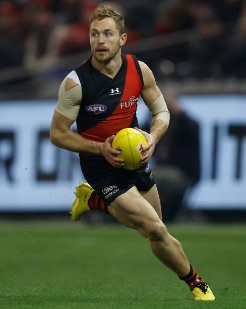 Devon Smith of the Bombers in action during the 2021 AFL Round 17 match between the Essendon Bombers and the Adelaide Crows at Marvel Stadium on July...