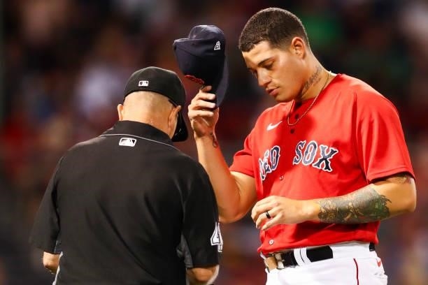 Yacksel Rios of the Boston Red Sox is checked for foreign or sticky substances in the sixth inning of a game against the Philadelphia Phillies at...