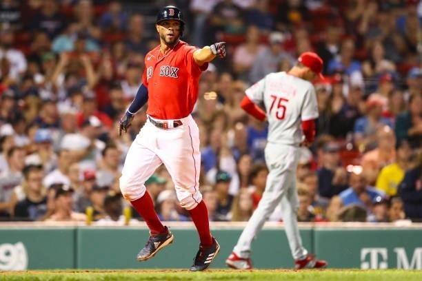 Xander Bogaerts of the Boston Red Sox scores in the sixth inning of a game against the Philadelphia Phillies at Fenway Park on July 9, 2021 in...