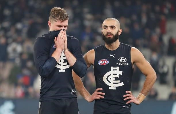 Jack Newnes and Adam Saad of the Blues look dejected after a loss during the 2021 AFL Round 17 match between the Carlton Blues and the Geelong Cats...