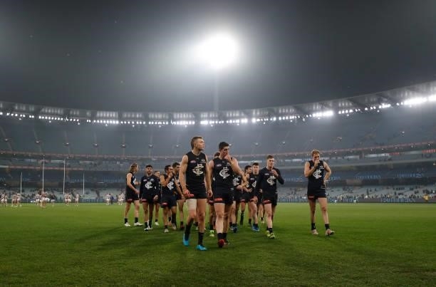 The Blues look dejected after a loss during the 2021 AFL Round 17 match between the Carlton Blues and the Geelong Cats at the Melbourne Cricket...