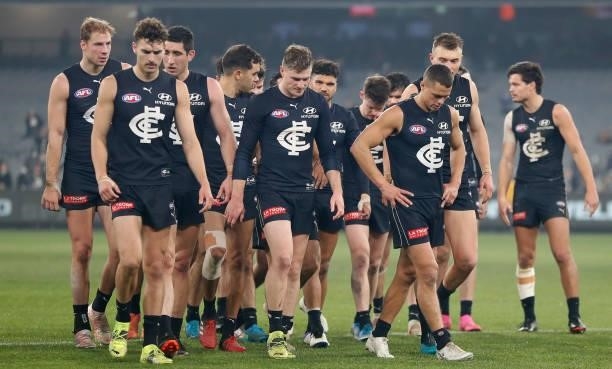 The Blues look dejected after a loss during the 2021 AFL Round 17 match between the Carlton Blues and the Geelong Cats at the Melbourne Cricket...