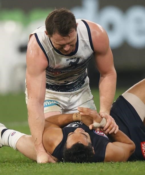 Patrick Dangerfield of the Cats checks on Eddie Betts of the Blues during the 2021 AFL Round 17 match between the Carlton Blues and the Geelong Cats...