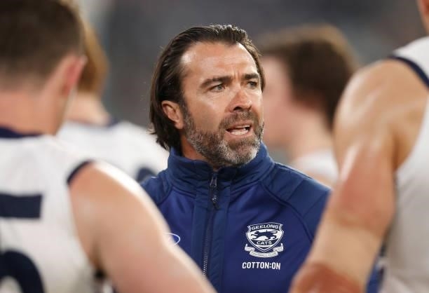 Chris Scott, Senior Coach of the Cats addresses his players during the 2021 AFL Round 17 match between the Carlton Blues and the Geelong Cats at the...