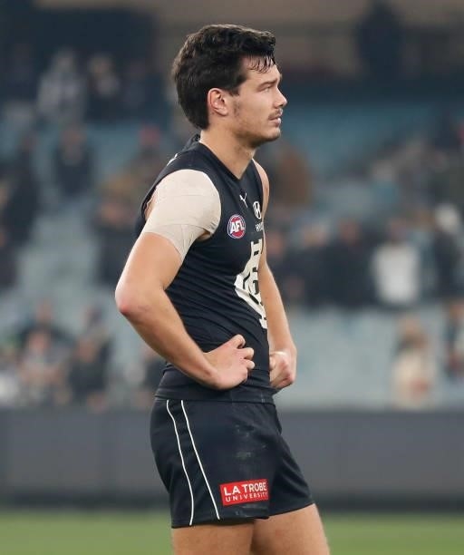Jack Silvagni of the Blues looks dejected after a loss during the 2021 AFL Round 17 match between the Carlton Blues and the Geelong Cats at the...