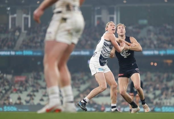 Mark Blicavs of the Cats and Harry McKay of the Blues compete in a ruck contest during the 2021 AFL Round 17 match between the Carlton Blues and the...