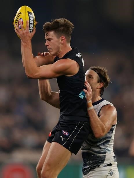 Paddy Dow of the Blues and Lachie Henderson of the Cats compete for the ballduring the 2021 AFL Round 17 match between the Carlton Blues and the...