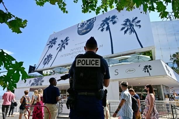 French policeman stands guard outside the Palais des Festivals during the 74th edition of the Cannes Film Festival in Cannes, southern France, on...