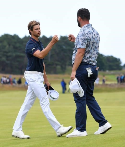 Thomas Detry and Jon Rahm are pictured during day three of the abrdn Scottish Open at the Renaissance Club on July 10 in North Berwick, Scotland.