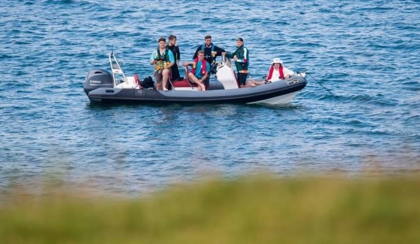 Fans watch on from a boat during day three of the abrdn Scottish Open at the Renaissance Club on July 10 in North Berwick, Scotland.