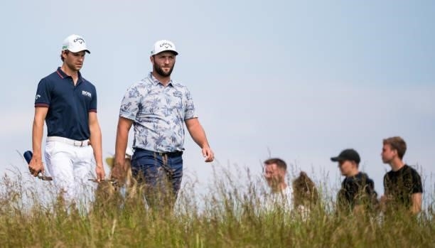 Thomas Detry and Jon Rahm are pictured during day three of the abrdn Scottish Open at the Renaissance Club on July 10 in North Berwick, Scotland.