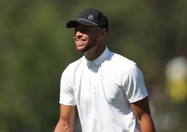 Athlete Steph Curry smiles on the second hole during round two of the American Century Championship at Edgewood Tahoe South golf course on July 10,...