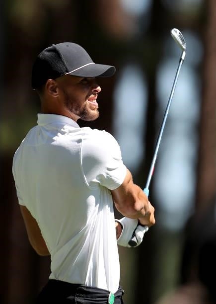 Athlete Steph Curry tees off on the 4th hole of the American Century Championship at Edgewood Tahoe South golf course on July 10, 2020 in South Lake...