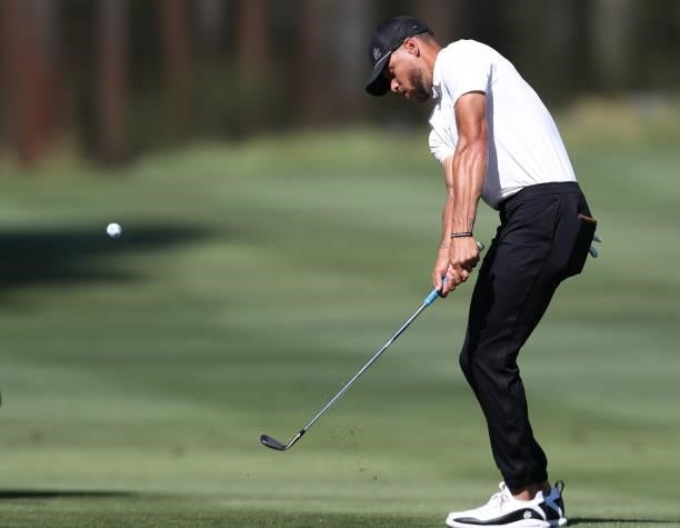 Athlete Steph Curry hits a shot on the second hole during round two of the American Century Championship at Edgewood Tahoe South golf course on July...