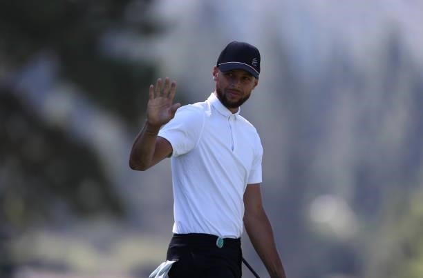 Athlete Steph Curry waves on the second hole during round two of the American Century Championship at Edgewood Tahoe South golf course on July 10,...