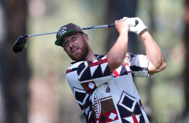 Athlete Travis Kelce tees off on the second hole during round two of the American Century Championship at Edgewood Tahoe South golf course on July...