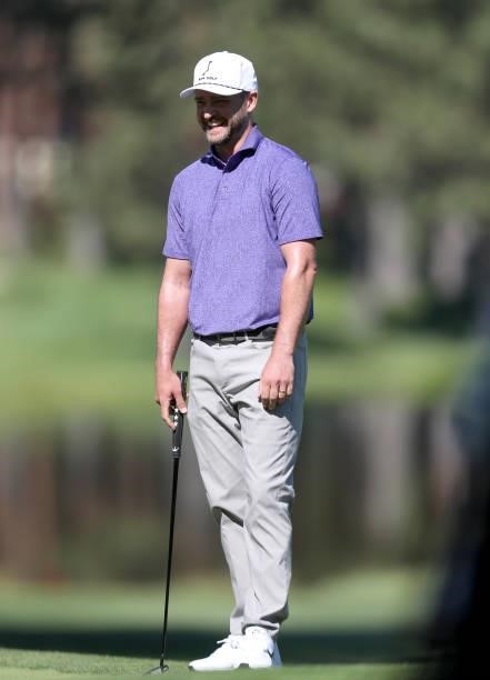 Musician Justin Timberlake looks on from the second hole during round two of the American Century Championship at Edgewood Tahoe South golf course on...