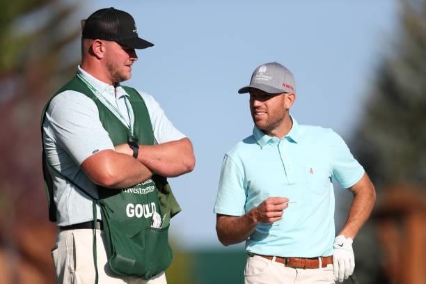 Athlete Robbie Gould and his caddy NFL athlete Mike McGlinchey look on from the fist hole during round two of the American Century Championship at...