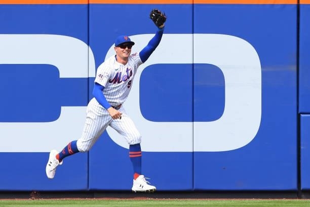 Centerfielder Brandon Nimmo of the New York Mets reacts after he made a leaping catch to rob Bryan Reynolds of the Pittsburgh Pirates of a home run...
