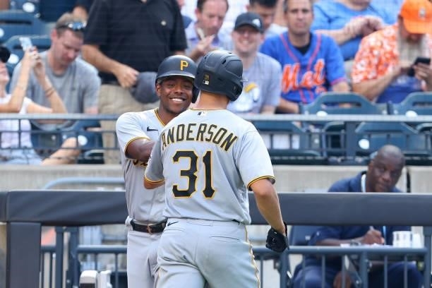 Pitcher Tyler Anderson of the Pittsburgh Pirates is congratulated by Ke'Bryan Hayes after he hit a home run during the fifth inning against the New...
