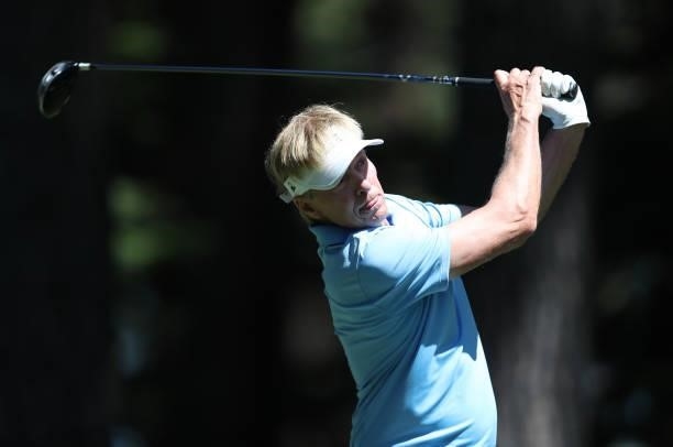 Actor Jack Wagner tees off on the fourth hole of the American Century Championship at Edgewood Tahoe South golf course on July 10, 2020 in South Lake...