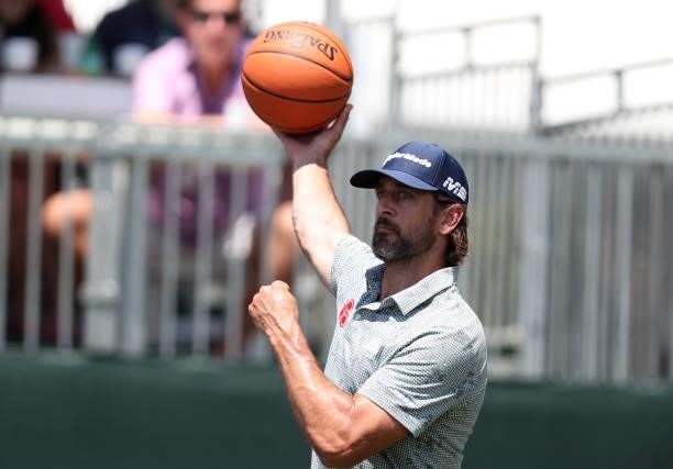 Athlete Aaron Rodgers shoots a basketball on the 17th hole during round two of the American Century Championship at Edgewood Tahoe South golf course...