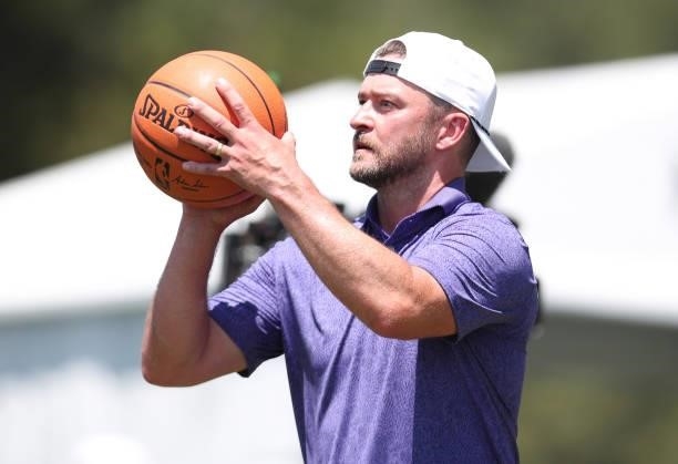 Musician Justin Timberlake shoots a basketball on the 17th hole during round two of the American Century Championship at Edgewood Tahoe South golf...
