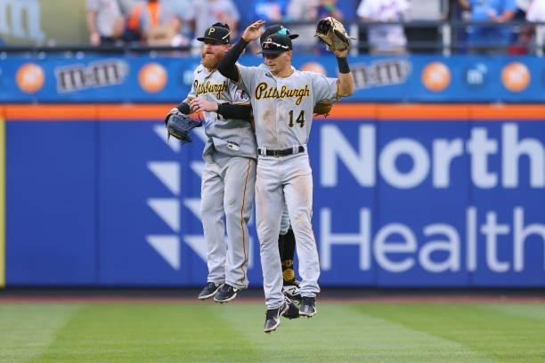 Ben Gamel, Bryan Reynolds and Jared Oliva of the Pittsburgh Pirates celebrate after the final out against the New York Mets during game one of a...
