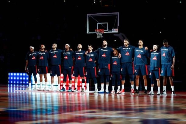 Team France stands for the national anthem before the preparation for Olympic Games basketball match between France and Spain at Accor Arena on July...