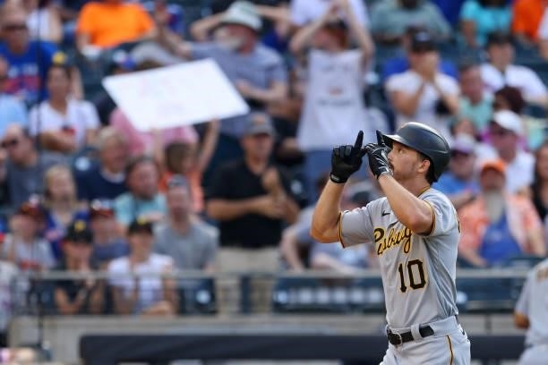 Bryan Reynolds of the Pittsburgh Pirates gestures after he hit a two-run home run during the sixth inning against the New York Mets during game one...