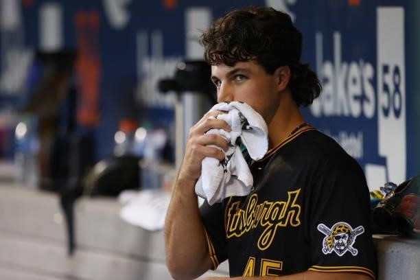 Pitcher Max Kranick of the Pittsburgh Pirates sits in the dugout after the first inning against the New York Mets during the second game of a double...