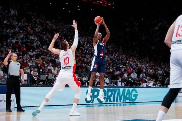 Frank Ntilikina of France shoots a three points against Victor Claver of Spain during the preparation for Olympic Games basketball match between...