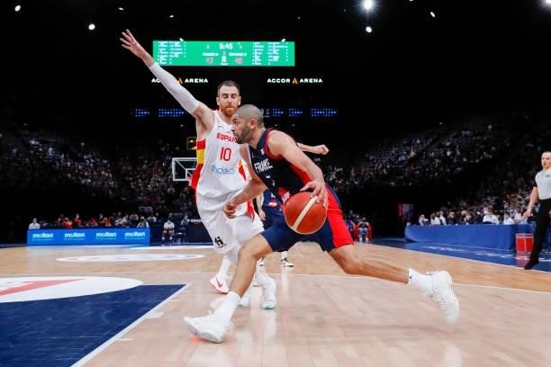 Nicolas Batum of France drives to the basket against Victor Claver of Spain during the preparation for Olympic Games basketball match between France...