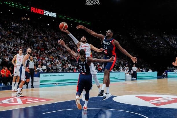 Ricky Rubio of Spain goes to the basket against Andrew Albicy and Moustapha Fall of France during the preparation for Olympic Games basketball match...