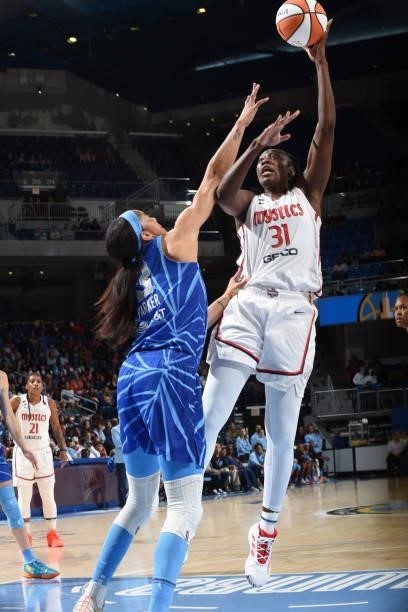 Tina Charles of the Washington Mystics shoots the ball over Candace Parker of the Chicago Sky on July 10, 2021 at the Wintrust Arena in Chicago,...
