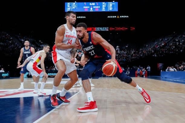 Rudy Gobert of France drives to the basket against Willy Hernangomez of Spain during the preparation for Olympic Games basketball match between...