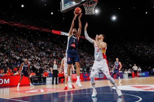 Nicolas Batum of France is at the basket against Victor Claver of Spain during the preparation for Olympic Games basketball match between France and...