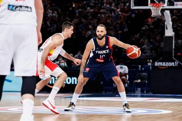 Evan Fournier of France dribbles the ball against Alberto Abalde of Spain during the preparation for Olympic Games basketball match between France...