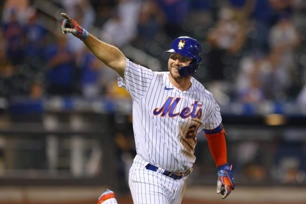 Pete Alonso of the New York Mets gestures after he hit a home run against the Pittsburgh Pirates during the third inning of the second game of a...