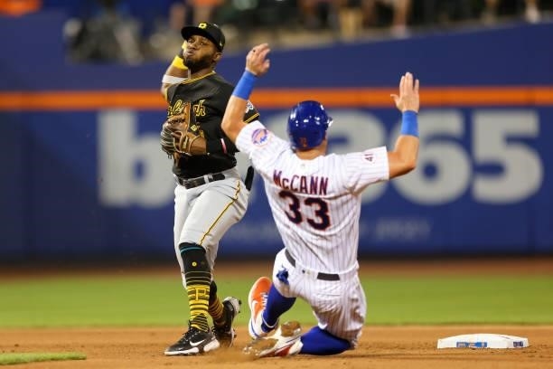 Second baseman Rodolfo Castro of the Pittsburgh Pirates gets the force out on James McCann of the New York Mets on a ball hit by Kevin Pillar of the...