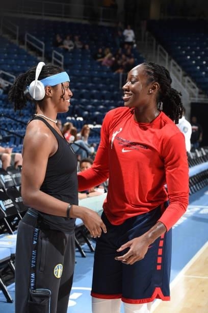 Diamond DeShields of the Chicago Sky talks with Tina Charles of the Washington Mystics before the game on July 10, 2021 at the Wintrust Arena in...