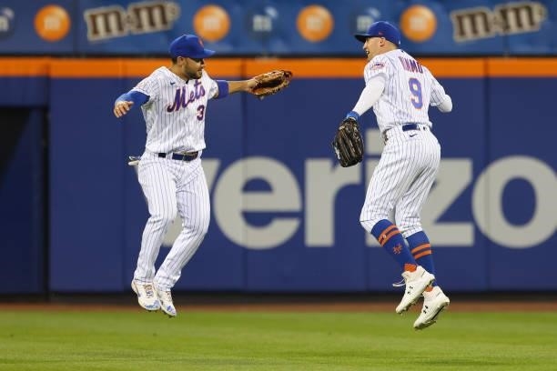 Michael Conforto and Brandon Nimmo of the New York Mets celebrate their 4-2 win over the Pittsburgh Pirates in the second game of a double header at...