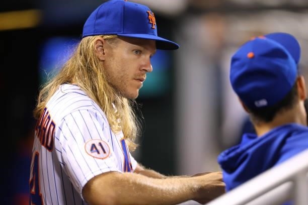 Noah Syndergaard of the New York Mets looks on from the dugout during the second game of a double header against the Pittsburgh Pirates at Citi Field...