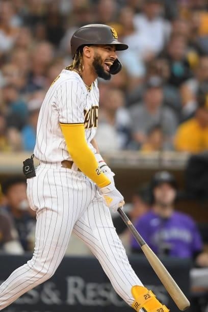Fernando Tatis Jr. #23 of the San Diego Padres laughs after taking a swing during the first inning of a baseball game against the Colorado Rockies at...