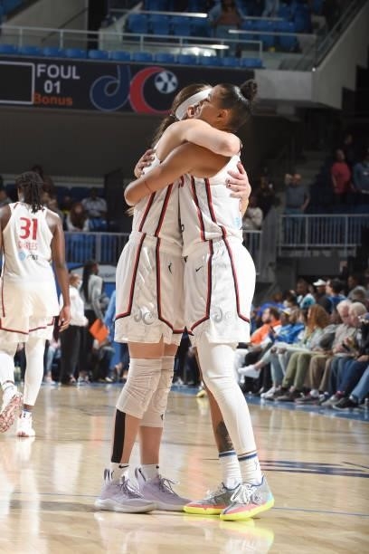 Sydney Wiese of the Washington Mystics hugs teammate Natasha Cloud after the game against the Chicago Sky on July 10, 2021 at the Wintrust Arena in...