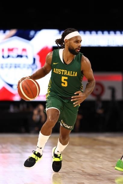 Patty Mills of the Australia Men's National Team dribbles the ball during the game against the Argentina Men's National Team on July 10, 2021 at...