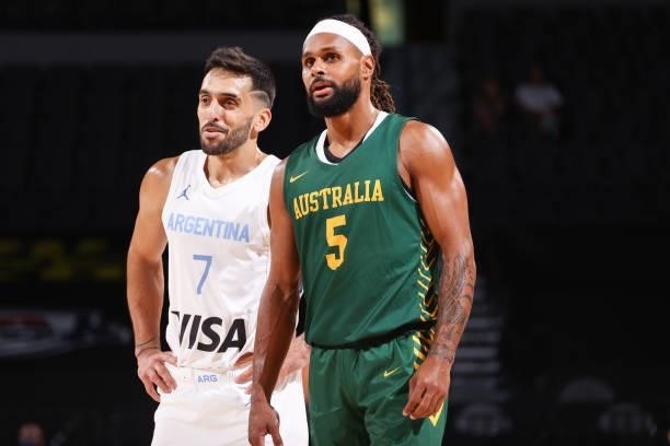Facundo Campazzo of the Argentina Men's National Team talks to Patty Mills of the Australia Men's National Team during the game on July 10, 2021 at...